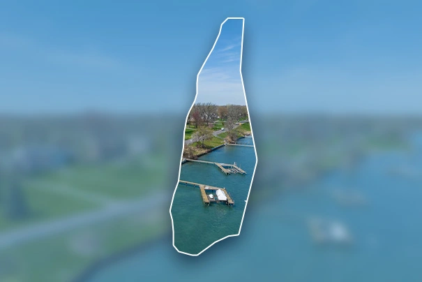 Aerial view of Grosse Ile Township, MI, showing waterways and docks, representing local primary care services.